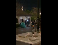 Girl wearing blue dress has outdoor photoshoot 