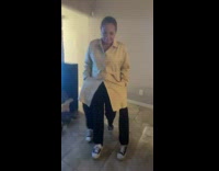 Woman walks into room with 2 fake legs costume