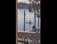 Woman headstand yoga fail paddleboard lake
