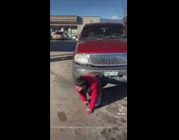 3 guys pose at gas station 