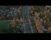 Combined time lapse drone fly over road and trees