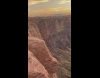 Girl black shirt stand canyon cliff tourists