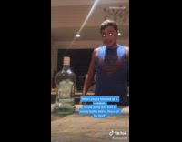 Guy shifty eyes filter takes liquor bottle 