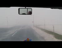 Guys drive through a sandstorm windy mirror