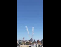 Collab WINY - person on roof films jet planes over her