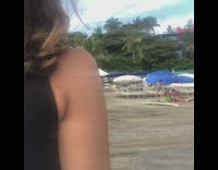 Collab Kook Of The Day - Woman practices surfing on white surfboard in the sand