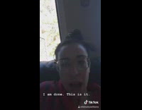 Cat walks with barbie doll in mouth