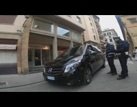 Police fines and argues person inside the parked vehicle