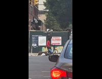 Collab winy - Filmer laughs at cyclist balancing trash can on head part 1