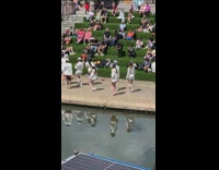 Kpop dancers captain hat people on stairs watch