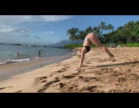 Blonde girl bikini worm dance towards beach