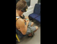 Collab Subway Creatures - guy in white orange shirt rubix cube on train