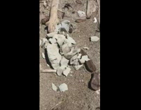 Collab DailyDoseOfInternet - Filmer finger poke cracked stones crumbled ground