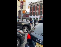 Collab Subway Creatures - Man black shirt workout with resistance bands tied to traffic light