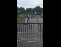 Guy sits inside shopping cart and rides down skateboarding ramp
