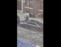 Man Does Stretches while Laid on Sidewalk