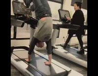 Indoor gym treadmill handstand 