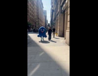 Submitter shows Chainguard mascot walk on street