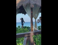 Woman picture tiki hut beach