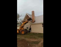 Man tries to catch chimney with backhoe