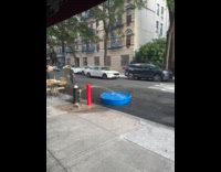 Broken fire hydrant fills up inflatable pool