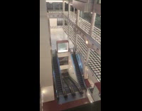 Empty mall building with escalator liminal space