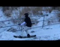 Collab ShredSlams - Snowboarder jumps off ramp, grinds rail, and falls on butt