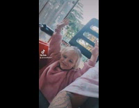 Little girl on rollercoaster goes from excited to scared