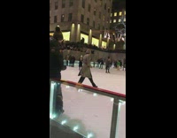 Man dances on ice skates in ice rink