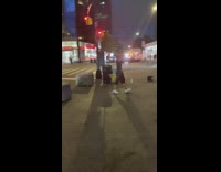 Guy raps at night on street near store 