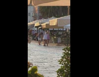 Two women dress sexy dance on the street