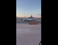 Woman black tank top sit on car roof