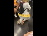 Collab Subway Creatures - Person kneels and crawls on train in Trump costume 
