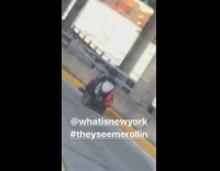 person on motorized scooter on freeway