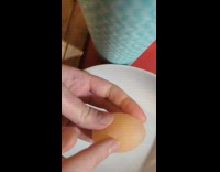 Soft egg without shell sliced on plate
