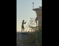 Pink bikini girl lifeguard tower beach guy 