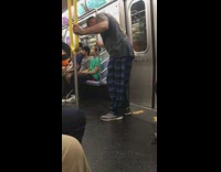 Collab Subway Creatures - Guy blue plaid pants sleeps while standing up holds onto pole on subway train