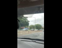 Guy waves american flag bridge freeway highway 