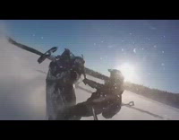 Guy on purple snowmobile does wheelie snow