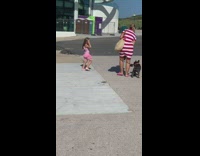Pink skirt little girl one arm raised 