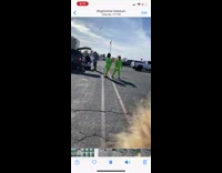 two men bright green outfits dance