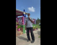 Old man grey shirt make rooster sound