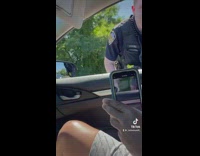 Woman drives off arguing with police officer 