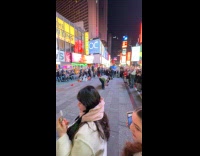 Man jumping over 4 people at times square