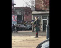 Random person in kilt playing bagpipes in the street
