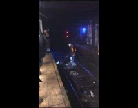 Guy Climbs From Under Train Tracks 