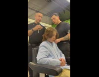 Handsome young man gets a hair cut