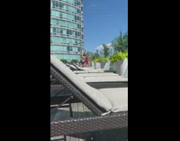 Pink bikini girl pool blue speedo guy