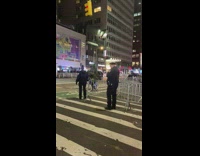 Christmas tree riding bicycle stops to talk to police officer 