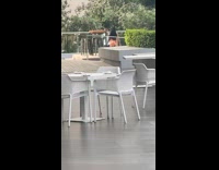 Woman orange blouse shorts model walk chairs